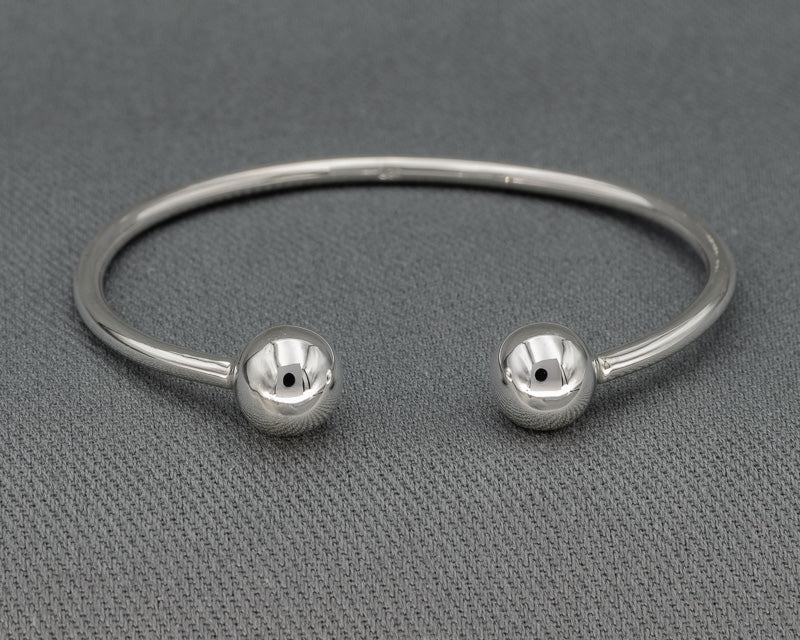 Sterling silver round bangle with a 10 mm silver ball at the ends