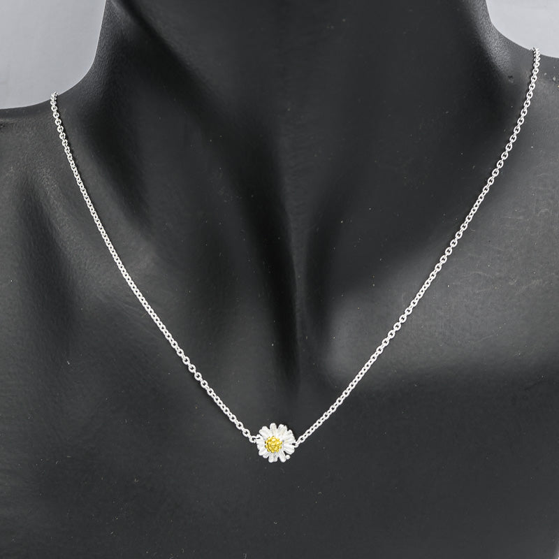 Sterling silver chain with a daisy pendant