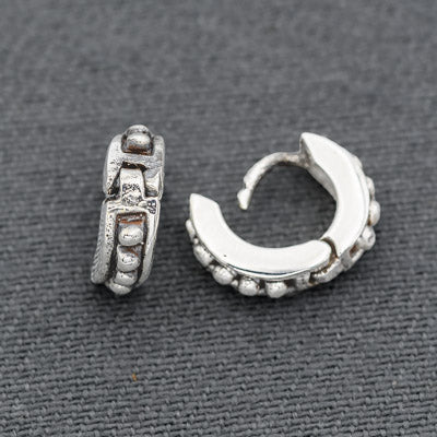 Sterling silver dotted huggie earrings