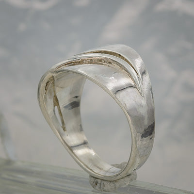 Sterling silver band with a flowing line