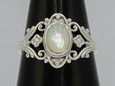 Patterned sterling silver sing with a mother of pearl stone