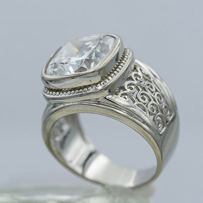 Sterling silver ring with a square cubic and filigree patterns