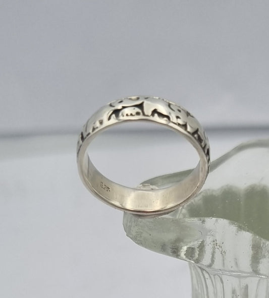Sterling silver band with elephants
