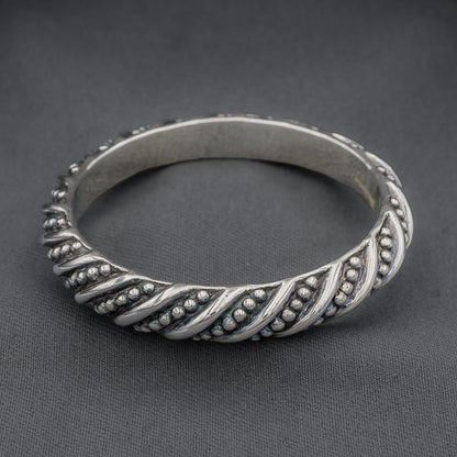 Sterling silver bangle with studs and stripes