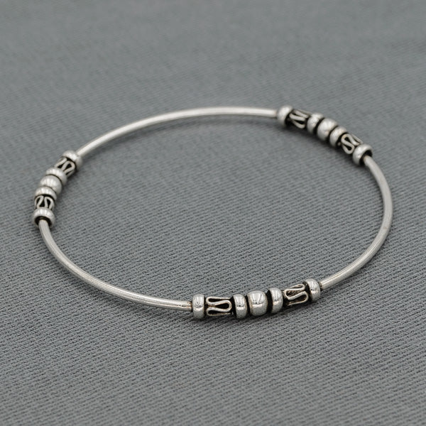 Sterling silver bangle with bead patterns