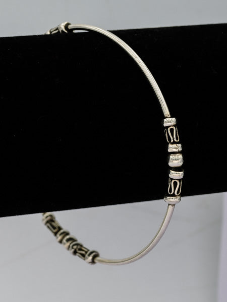 Sterling silver bangle with bead patterns