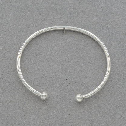 Sterling silver round bangle with a 6mm silver ball at the ends