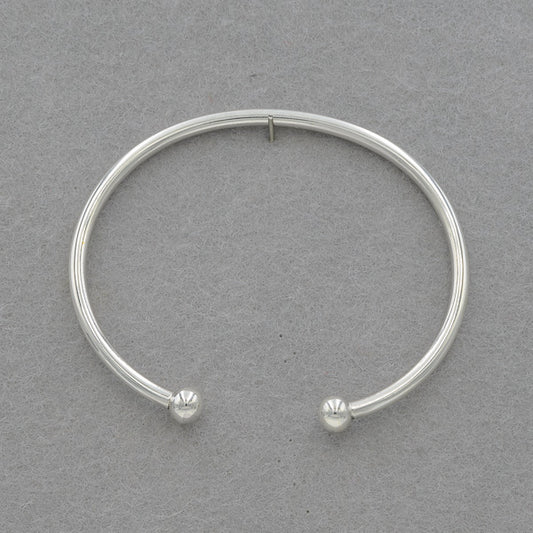 Sterling silver round bangle with a 6mm silver ball at the ends