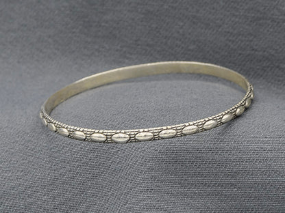 Sterling silver bangle with oval patterns