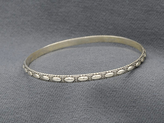 Sterling silver bangle with oval patterns