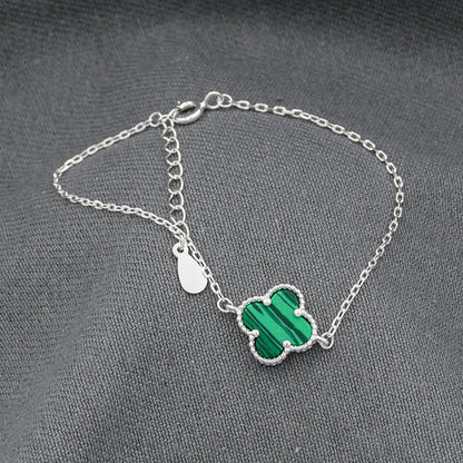 Sterling silver with a Malachite clover disc