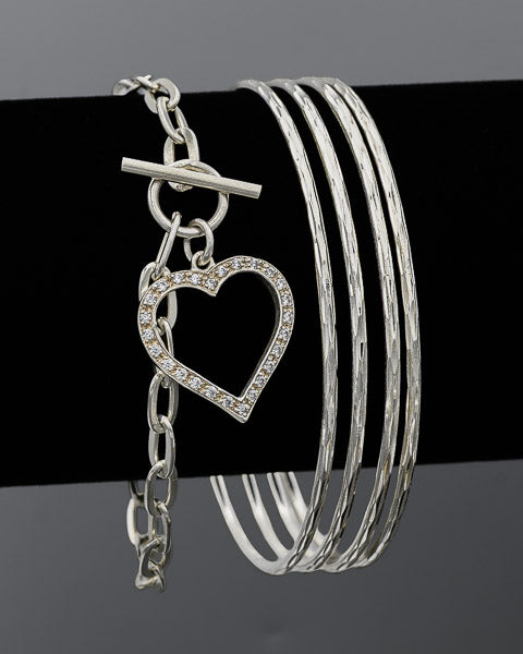 Sterling silver oval link bracelet with a toggle clasp and a cubic zirconia heart
