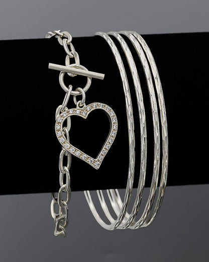 Sterling silver oval link bracelet with a toggle clasp and a cubic zirconia heart