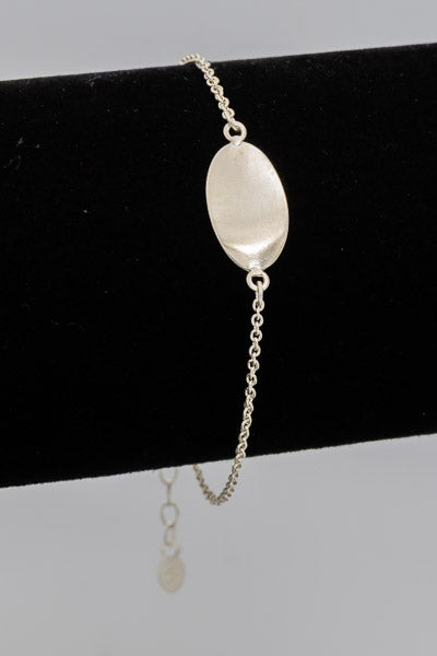 Sterling silver bracelet with an oval disc