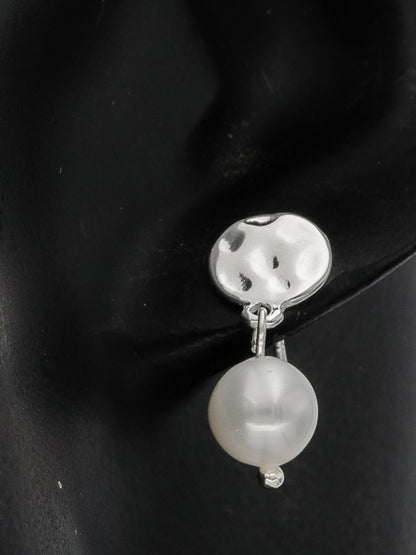 Sterling silver hammered disc with a pearl