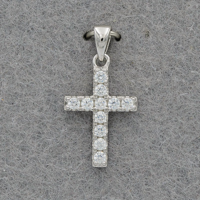 A small sterling silver cross set with cubic zirconia stones on a grey background.