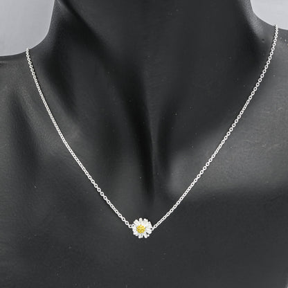 Sterling silver chain with a daisy pendant
