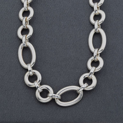 Sterling silver circle and oval chain with a signoretti clasp. 55cm