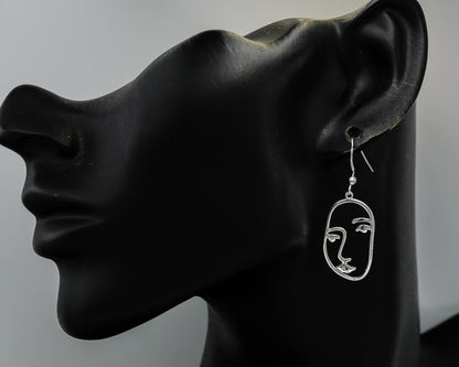 Sterling silver face earrings