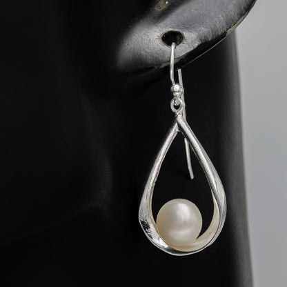 Sterling silver pear shaped danglers with a pearl