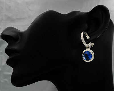 Sterling silver pretty woman with blue cubic zirconia.