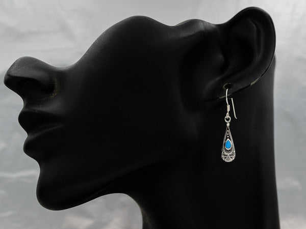 A sterling silver drop earring with a stone