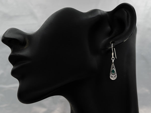 A sterling silver drop earring with a stone