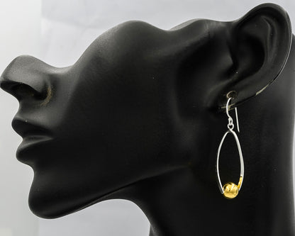 Sterling silver loop with a gold plated ball