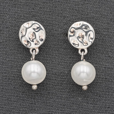 Sterling silver hammered disc with a pearl