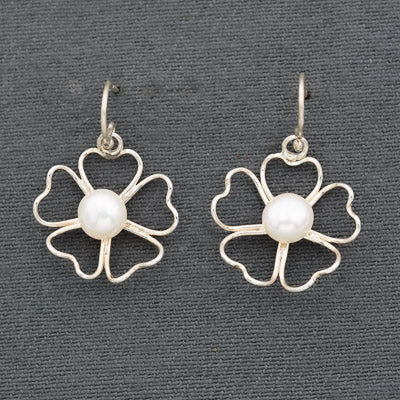 Sterling wired flower with a pearl earring