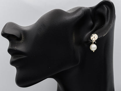 Sterling silver hammered disc with a pearl