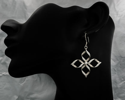 Sterling silver wired flower earring.