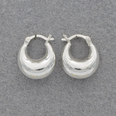 A small puffed half oval earring