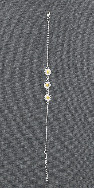 Sterling silver bracelet with 3 daisies with gold plated pollen