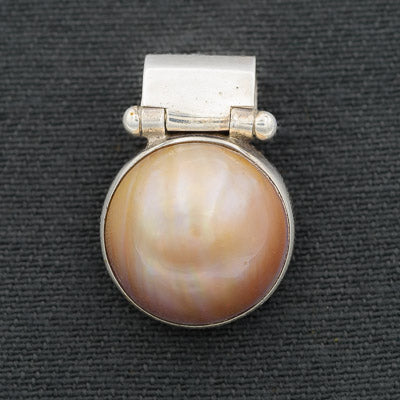 Burnt orange Mabe' set in silver