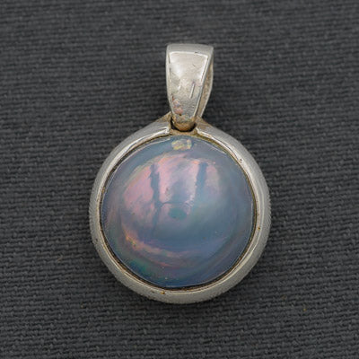 Blue mabe' set in silver pendant