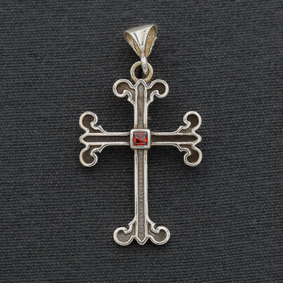 Sterling silver cross with a Garnet