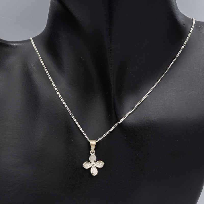 Sterling silver petite flower pendant