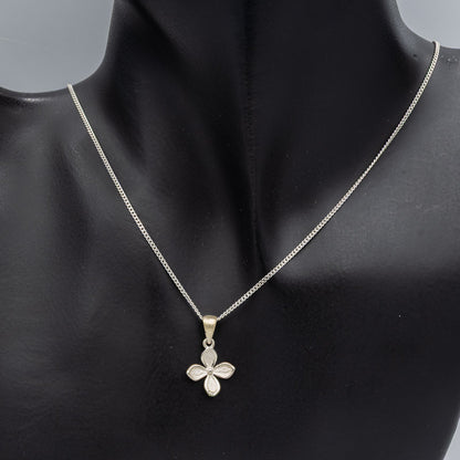 Sterling silver petite flower pendant