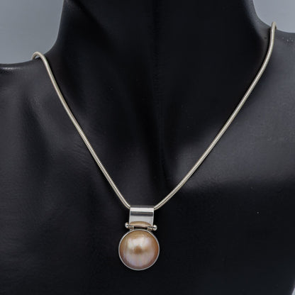 Burnt orange Mabe' set in silver