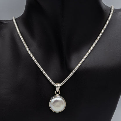 Round button pearl set in sterling silver