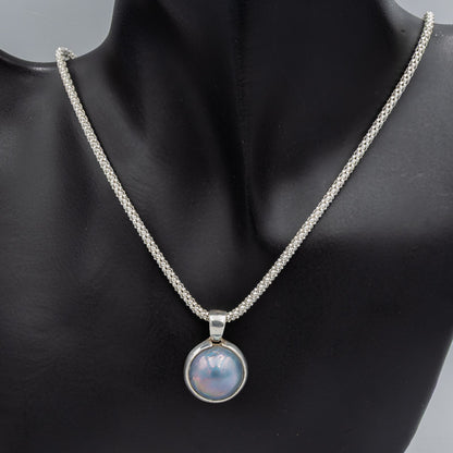 Blue mabe' set in silver pendant