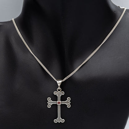 Sterling silver cross with a Garnet