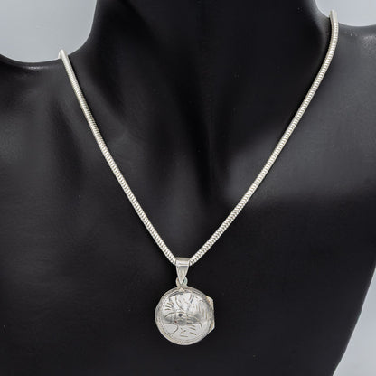 Sterling silver round engraved locket