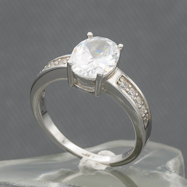 Oval cubic set in sterling silver ring with cubics on the side