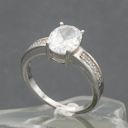 Oval cubic set in sterling silver ring with cubics on the side