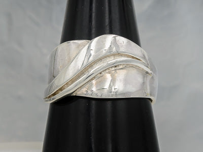 Sterling silver band with a flowing line