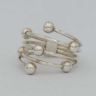 Sterling silver wrapped around ring with 7 balls