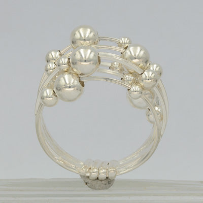 Sterling silver multiple wired ring with balls.