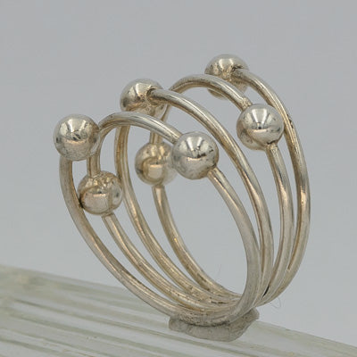 Sterling silver wrapped around ring with 7 balls